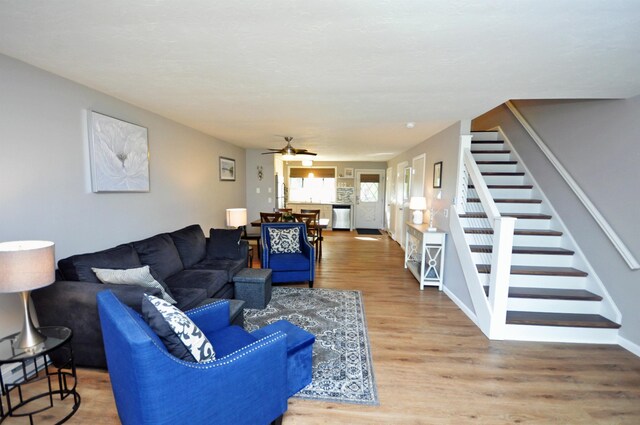 17 Village W Dr Unit 11, Bristol, NH 03222 - living room with stairs, wood finished floors, and ceiling fan