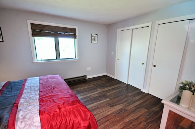 17 Village W Dr Unit 11, Bristol, NH 03222 - bedroom featuring a baseboard radiator, multiple closets, and dark wood-style floors