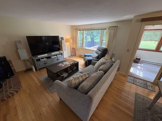 71 Esker Rd Unit B, Hampton, NH 03842 - living room featuring a baseboard heating unit and light wood-type flooring