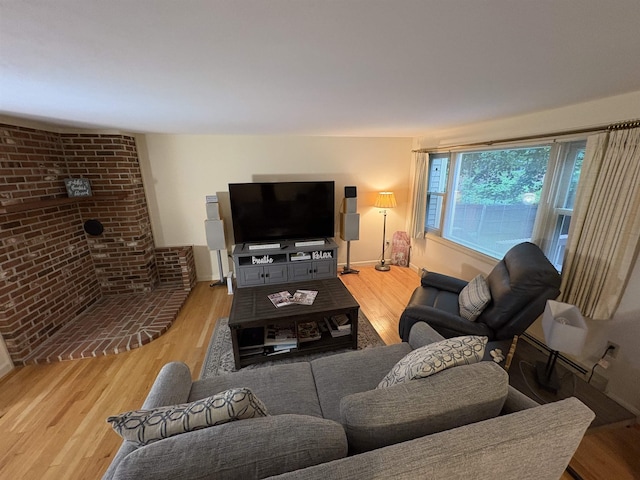 71 Esker Rd Unit B, Hampton, NH 03842 - living area featuring light wood finished floors and brick wall