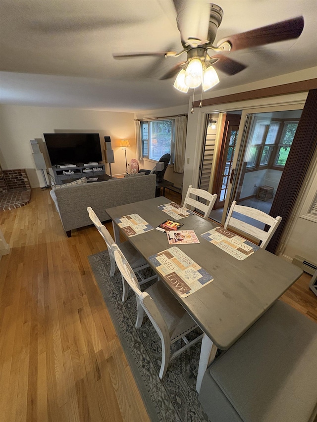 71 Esker Rd Unit B, Hampton, NH 03842 - dining area with a ceiling fan, wood finished floors, and a baseboard heating unit
