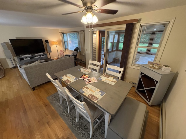 71 Esker Rd Unit B, Hampton, NH 03842 - dining space featuring light wood-style flooring, a ceiling fan, and a baseboard heating unit