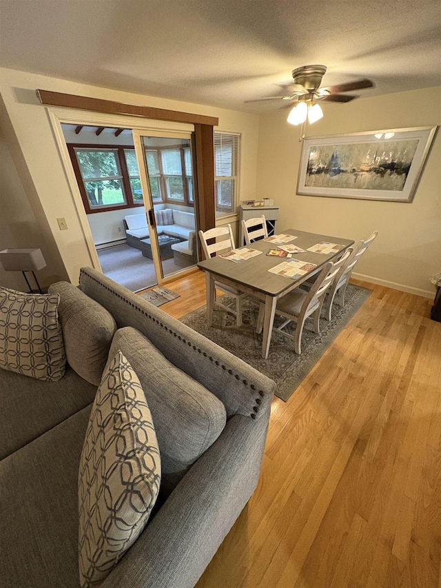 71 Esker Rd Unit B, Hampton, NH 03842 - dining area featuring light wood-style floors, ceiling fan, and a baseboard radiator