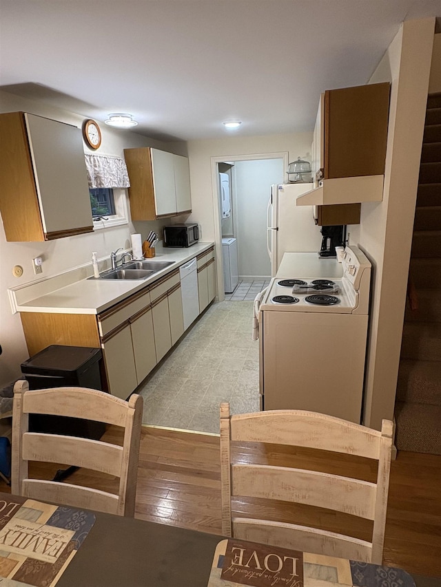 71 Esker Rd Unit B, Hampton, NH 03842 - kitchen with white appliances, light countertops, light wood-type flooring, and washer / clothes dryer