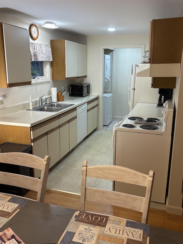 71 Esker Rd Unit B, Hampton, NH 03842 - kitchen featuring white appliances, washer / dryer, and light countertops