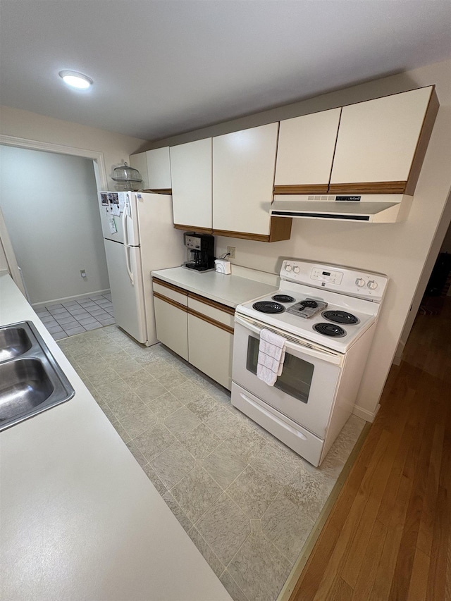 71 Esker Rd Unit B, Hampton, NH 03842 - kitchen featuring white appliances, under cabinet range hood, white cabinetry, light countertops, and recessed lighting