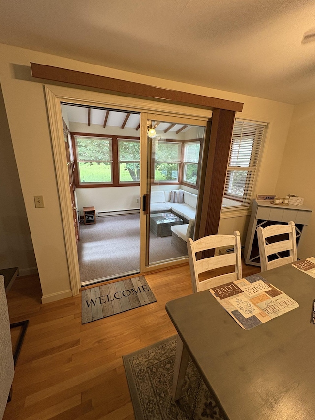 71 Esker Rd Unit B, Hampton, NH 03842 - dining room with baseboard heating, plenty of natural light, and light wood-style floors