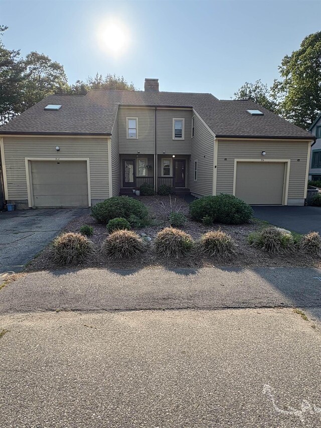71 Esker Rd Unit B, Hampton, NH 03842 - view of front of home with asphalt driveway and an attached garage
