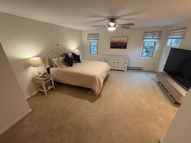 71 Esker Rd Unit B, Hampton, NH 03842 - bedroom with light carpet, a ceiling fan, and a baseboard heating unit