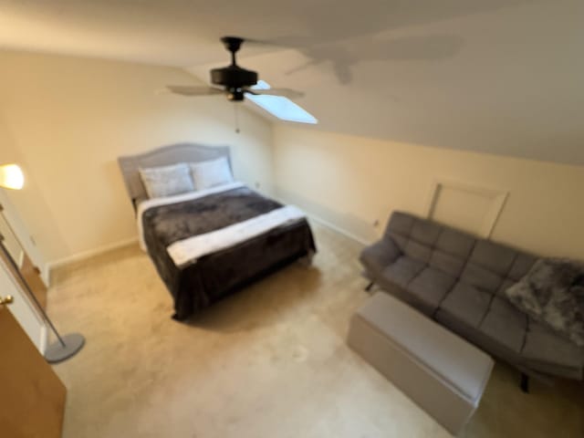 71 Esker Rd Unit B, Hampton, NH 03842 - bedroom featuring vaulted ceiling, light carpet, a skylight, and ceiling fan
