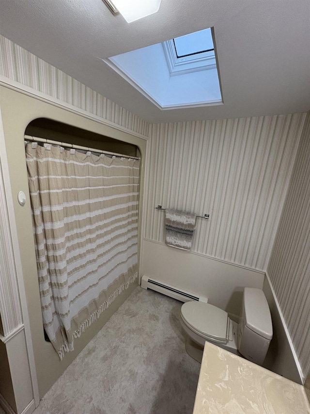 71 Esker Rd Unit B, Hampton, NH 03842 - bathroom featuring a baseboard heating unit, a skylight, and wallpapered walls