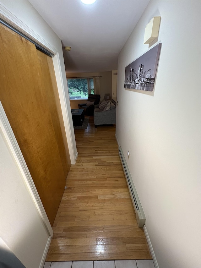 71 Esker Rd Unit B, Hampton, NH 03842 - corridor featuring a baseboard radiator and light wood-type flooring