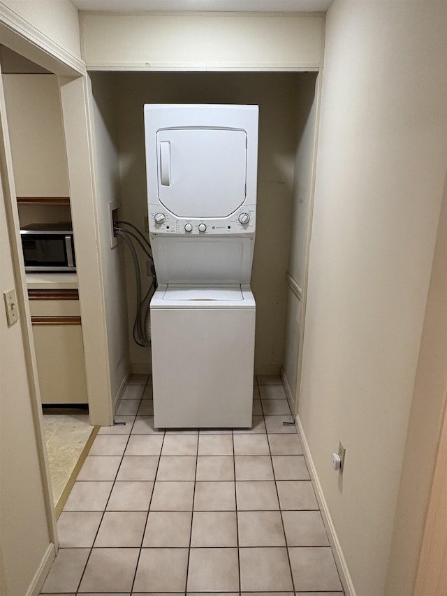 71 Esker Rd Unit B, Hampton, NH 03842 - laundry room with estacked washer and dryer and light tile patterned flooring