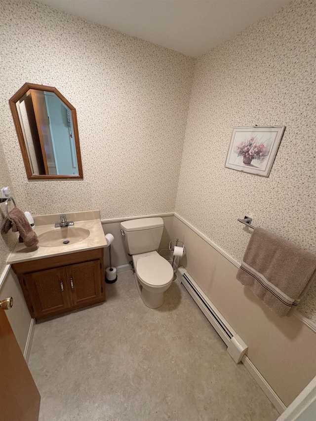 71 Esker Rd Unit B, Hampton, NH 03842 - half bath with a baseboard heating unit, vanity, and wallpapered walls