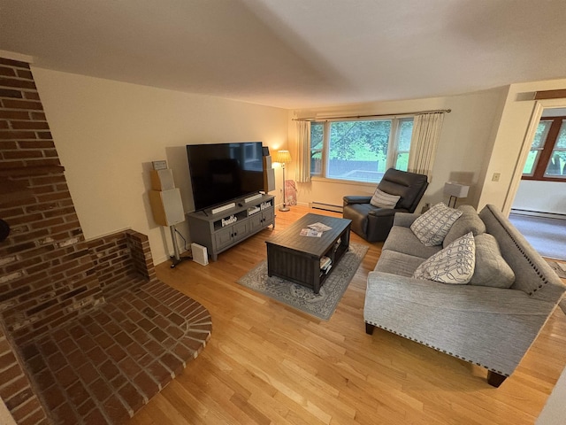 71 Esker Rd Unit B, Hampton, NH 03842 - living area featuring baseboard heating, light wood finished floors, and healthy amount of natural light