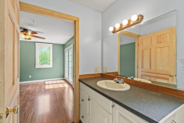 592 Old Bristol Rd, New Hampton, NH 03256 - bathroom with vanity, wood finished floors, and a ceiling fan