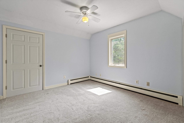 592 Old Bristol Rd, New Hampton, NH 03256 - spare room featuring vaulted ceiling, carpet flooring, a ceiling fan, and a baseboard radiator