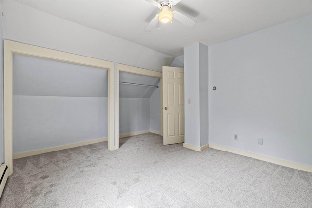 592 Old Bristol Rd, New Hampton, NH 03256 - unfurnished bedroom with lofted ceiling, carpet floors, multiple closets, ceiling fan, and a baseboard heating unit