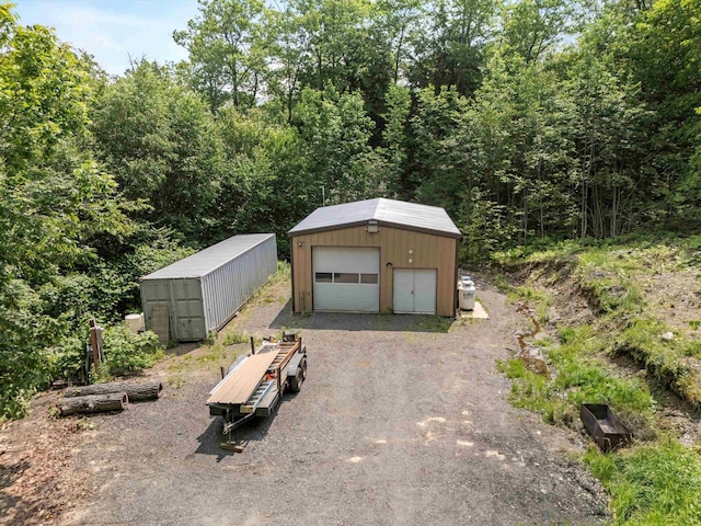 592 Old Bristol Rd, New Hampton, NH 03256 - detached garage with a view of trees