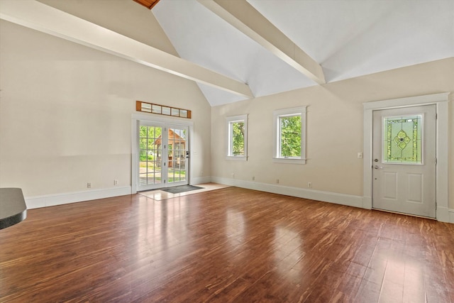 592 Old Bristol Rd, New Hampton, NH 03256 - unfurnished living room with wood finished floors, high vaulted ceiling, and french doors