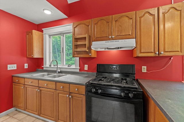 592 Old Bristol Rd, New Hampton, NH 03256 - kitchen featuring black range with gas stovetop, under cabinet range hood, brown cabinetry, and light tile patterned floors