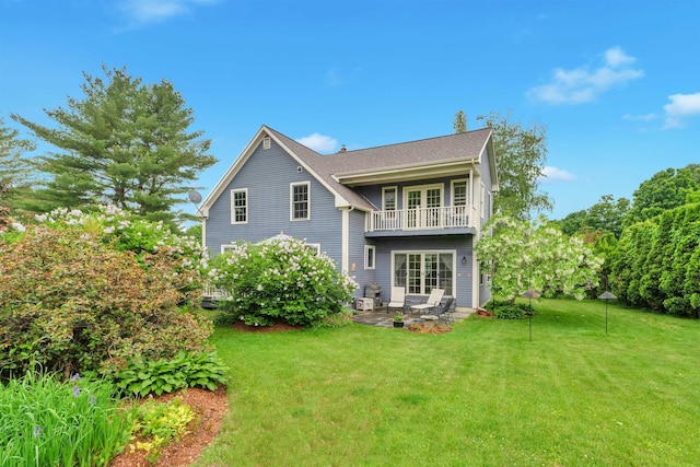 236 Lefebvre Ln, Williston, VT 05495 - rear view of property featuring a balcony, a yard, and a patio area