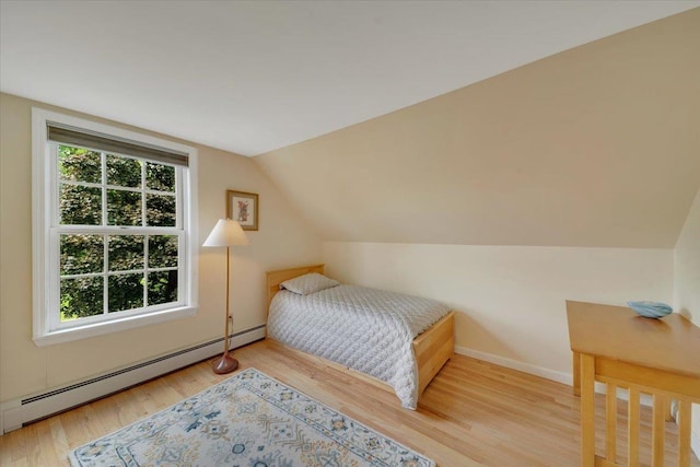236 Lefebvre Ln, Williston, VT 05495 - bedroom with baseboard heating, wood finished floors, and lofted ceiling