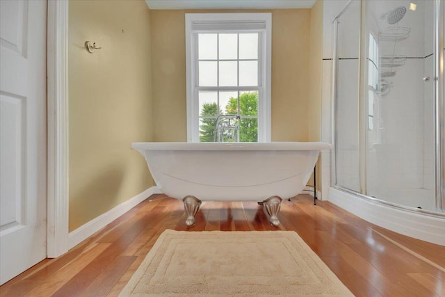 236 Lefebvre Ln, Williston, VT 05495 - bathroom featuring healthy amount of natural light, wood finished floors, and a freestanding bath