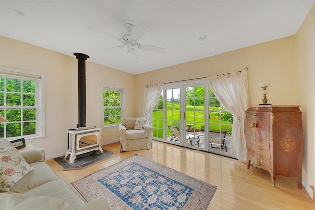 236 Lefebvre Ln, Williston, VT 05495 - living area with a wood stove, wood-type flooring, and a ceiling fan