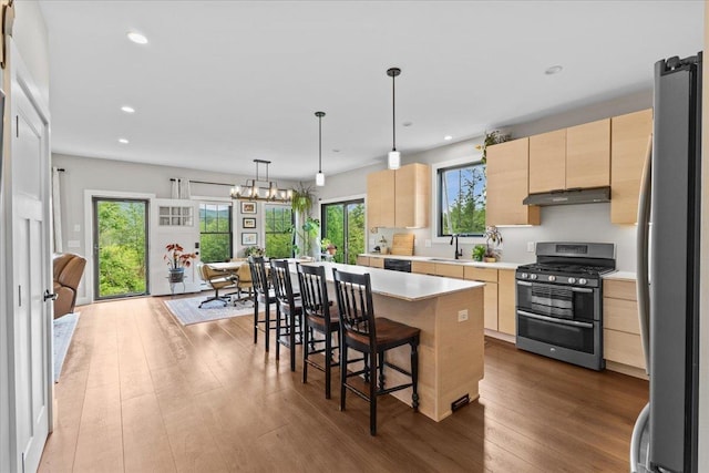 27 Hidden View Rd, Underhill, VT 05489 - kitchen with stainless steel appliances, light brown cabinetry, under cabinet range hood, light countertops, and recessed lighting