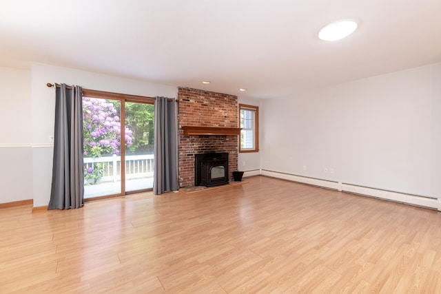 11 Penny Ln, Laconia, NH 03246 - unfurnished living room featuring a baseboard radiator and light wood finished floors