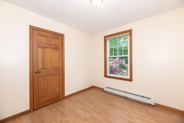 11 Penny Ln, Laconia, NH 03246 - empty room with baseboard heating and light wood-style flooring