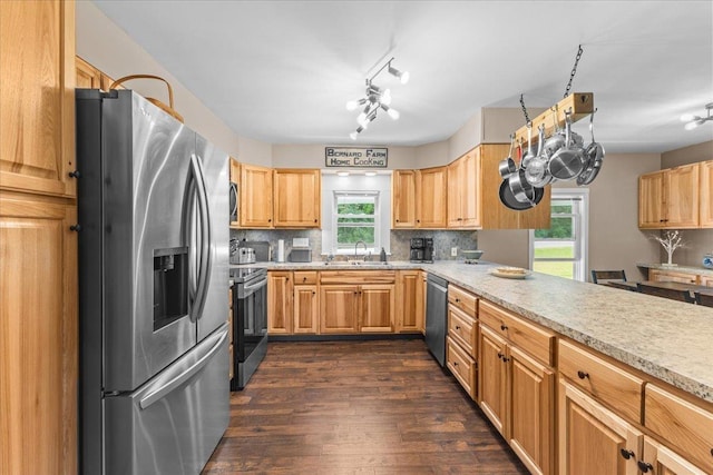 564 St Albans Rd, Swanton, VT 05488 - kitchen featuring appliances with stainless steel finishes, plenty of natural light, dark wood-style floors, and decorative backsplash