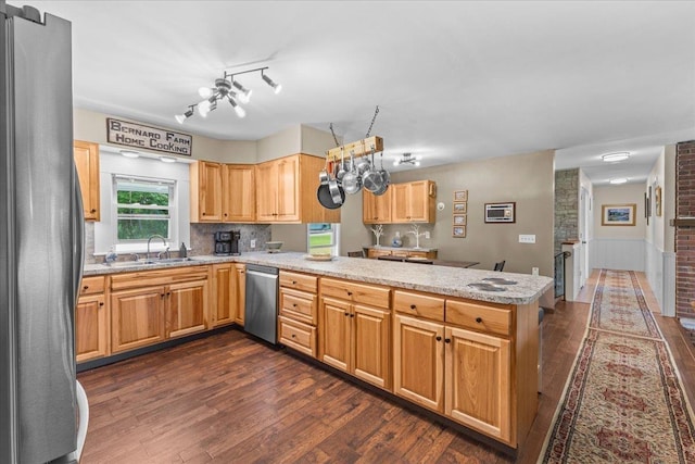 564 St Albans Rd, Swanton, VT 05488 - kitchen with appliances with stainless steel finishes, a peninsula, and dark wood-style flooring