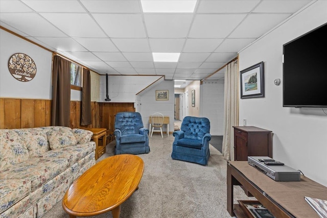 564 St Albans Rd, Swanton, VT 05488 - living room with carpet, wood walls, a drop ceiling, and wainscoting