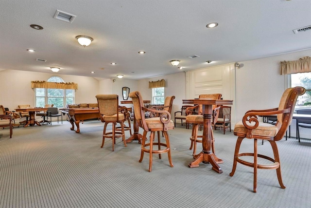 89 Eastern Ave Unit 306, Manchester, NH 03104 - dining space with light carpet, healthy amount of natural light, and recessed lighting