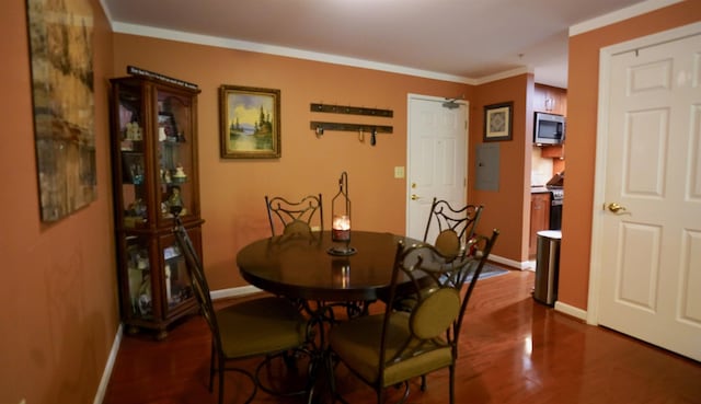 89 Eastern Ave Unit 306, Manchester, NH 03104 - dining room featuring dark wood-type flooring and crown molding