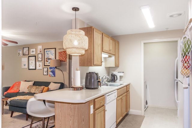 4 Crestview Cir Unit 106, Londonderry, NH 03053 - kitchen featuring white appliances, a ceiling fan, light brown cabinetry, open floor plan, and light countertops