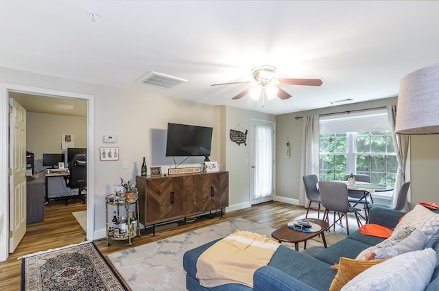 4 Crestview Cir Unit 106, Londonderry, NH 03053 - living area with a ceiling fan, wood finished floors, and an office area