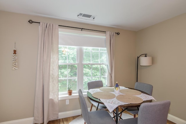 4 Crestview Cir Unit 106, Londonderry, NH 03053 - dining area featuring plenty of natural light and wood finished floors