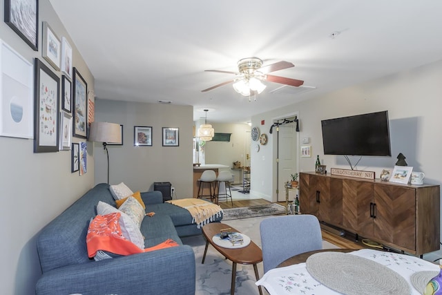 4 Crestview Cir Unit 106, Londonderry, NH 03053 - living area featuring ceiling fan and wood finished floors