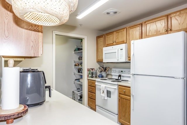 4 Crestview Cir Unit 106, Londonderry, NH 03053 - kitchen featuring white appliances and light countertops