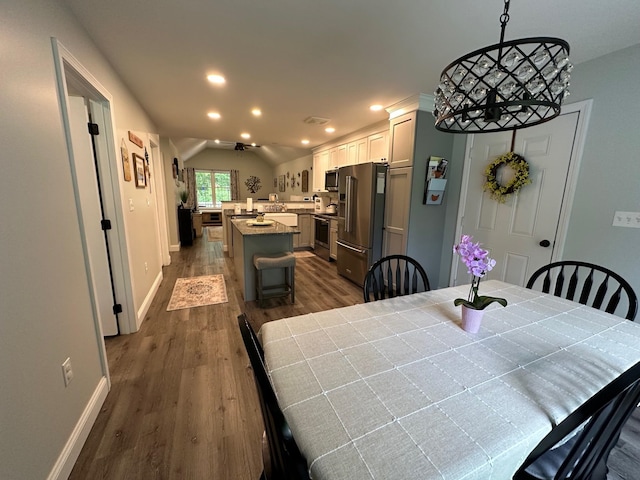 326 Dublin Rd, Jaffrey, NH 03452 - dining room featuring dark wood-type flooring, recessed lighting, and vaulted ceiling