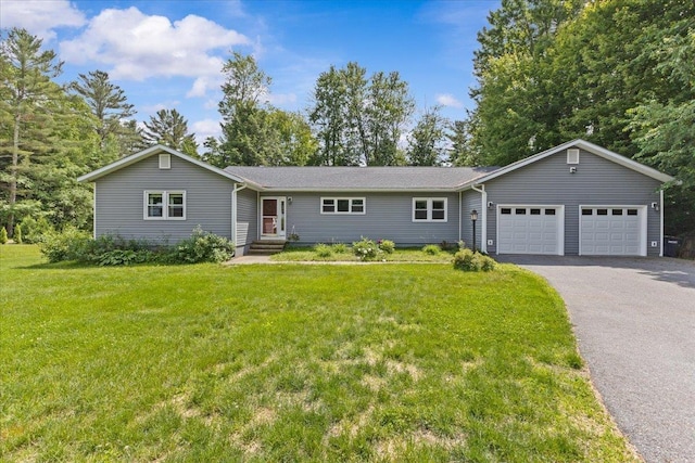 33 Winterlane Cir, Essex, VT 05452 - ranch-style house featuring driveway, a garage, and a front lawn