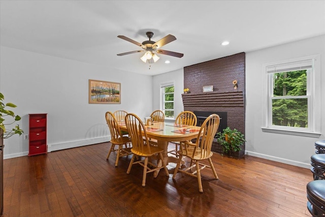33 Winterlane Cir, Essex, VT 05452 - dining room featuring a baseboard radiator, hardwood / wood-style floors, recessed lighting, ceiling fan, and a brick fireplace