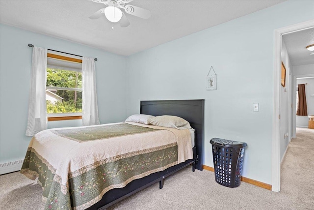 33 Winterlane Cir, Essex, VT 05452 - carpeted bedroom with a ceiling fan and a baseboard radiator
