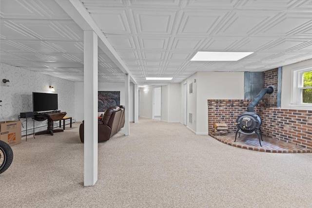 33 Winterlane Cir, Essex, VT 05452 - basement with a wood stove, carpet floors, and an ornate ceiling