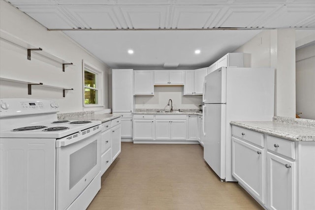 33 Winterlane Cir, Essex, VT 05452 - kitchen featuring white appliances, white cabinets, recessed lighting, open shelves, and light stone countertops