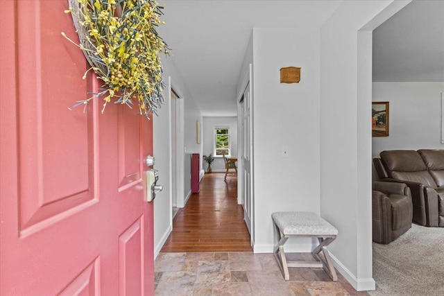 33 Winterlane Cir, Essex, VT 05452 - foyer with baseboards and light stone finish flooring