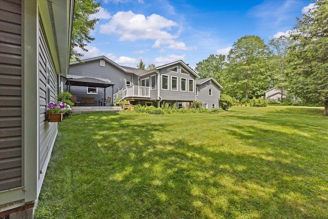 33 Winterlane Cir, Essex, VT 05452 - rear view of house with a gazebo, a patio area, and a lawn